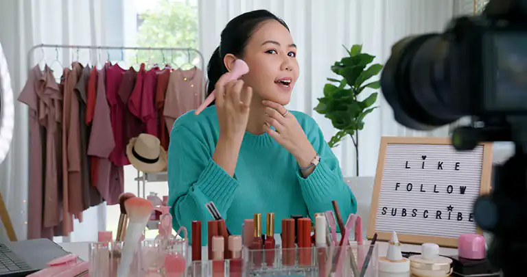 woman influencer showing makeup products