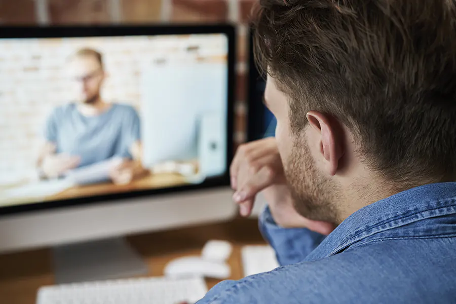 Man attending an online course