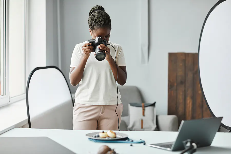 Woman taking photos to sell as stock photos